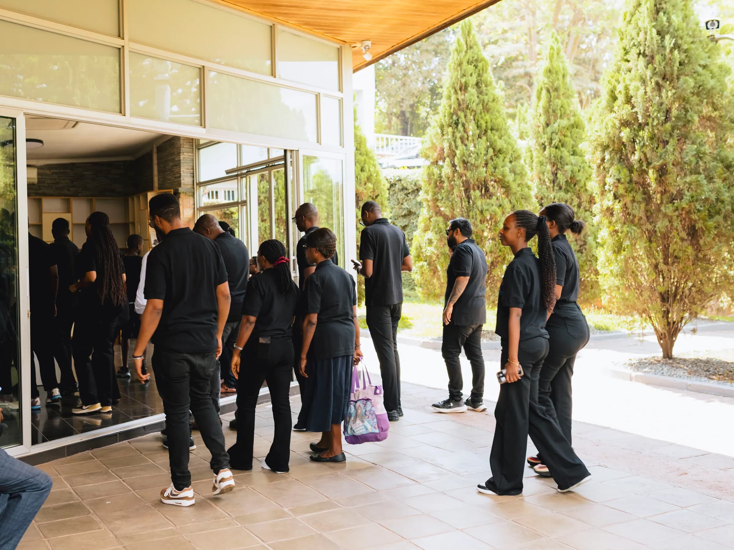 Team members entering the memorial building
