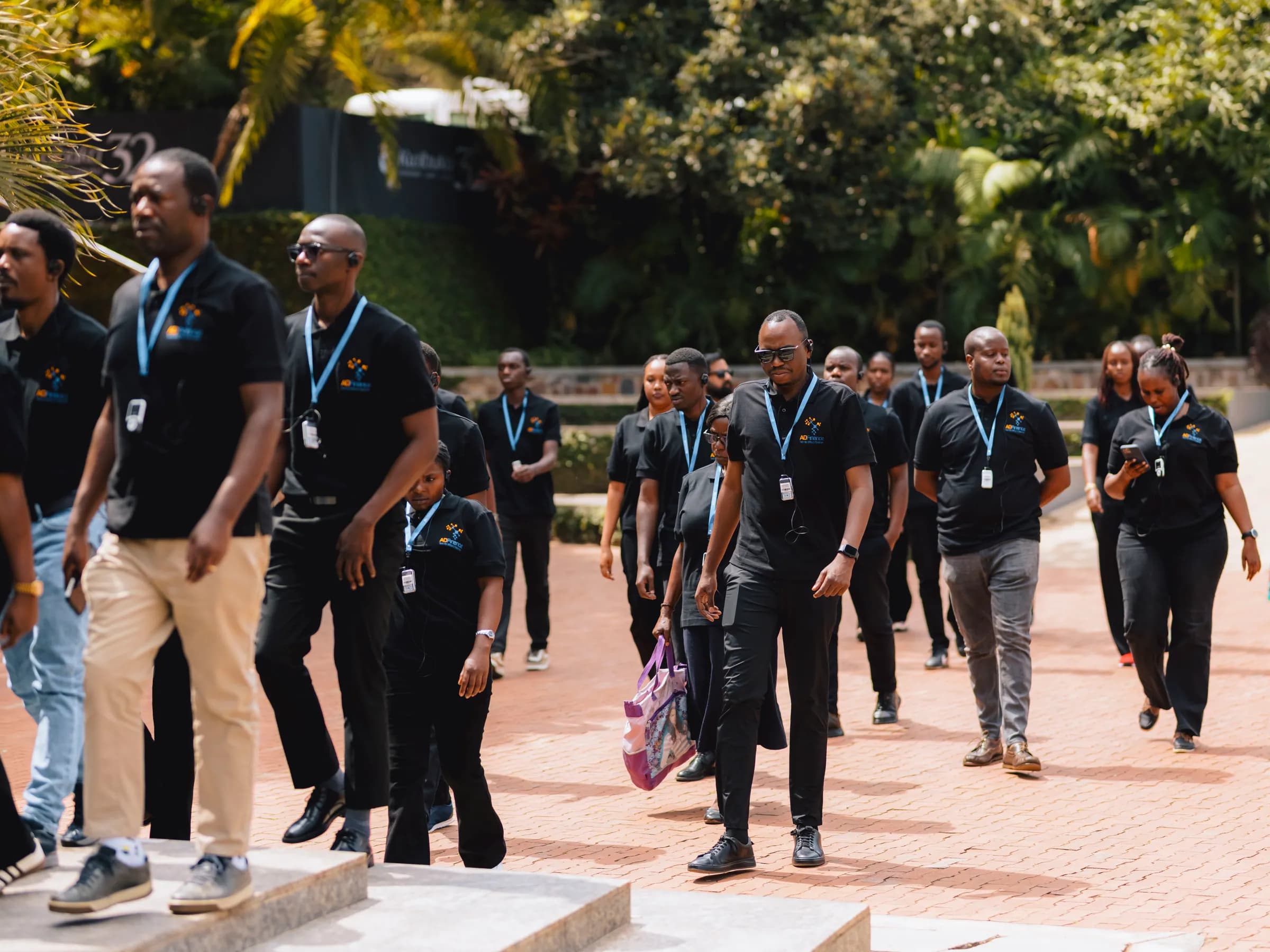 The team walking up the path through the memorial grounds